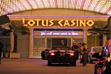 Golden Lotus Palace Casino riverside courtyard lit with lanterns at night